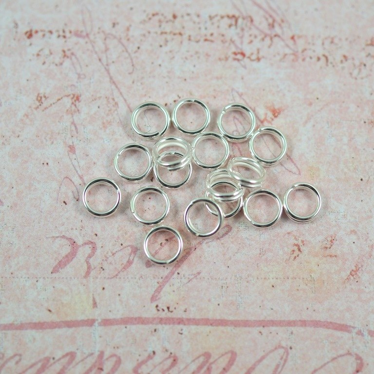 SPRĘŻYNKI SREBRNE . 6 mm 30szt SPRĘŻYNKI SREBRNE . 6 mm 30szt